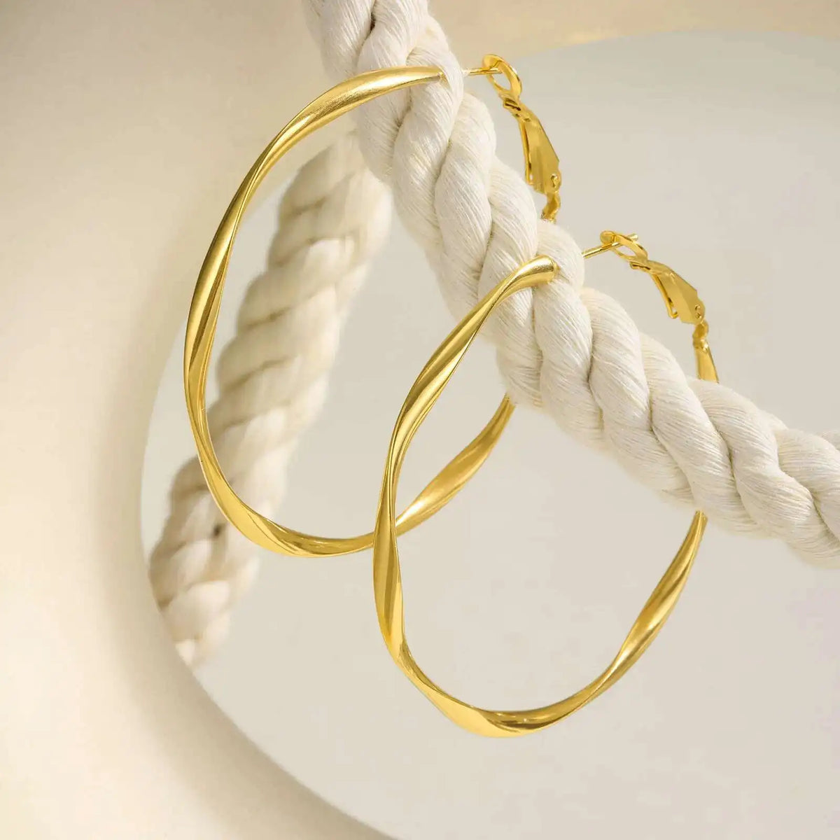 Stainless steel twist circle hoop earrings for women by HSF Marketplace