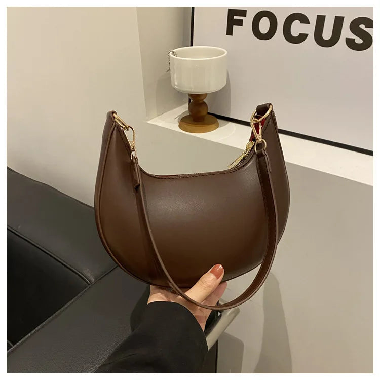 Luxury moon-shaped women's handbag by HSF Marketplace, elegant single shoulder purse with high-end fashion design.