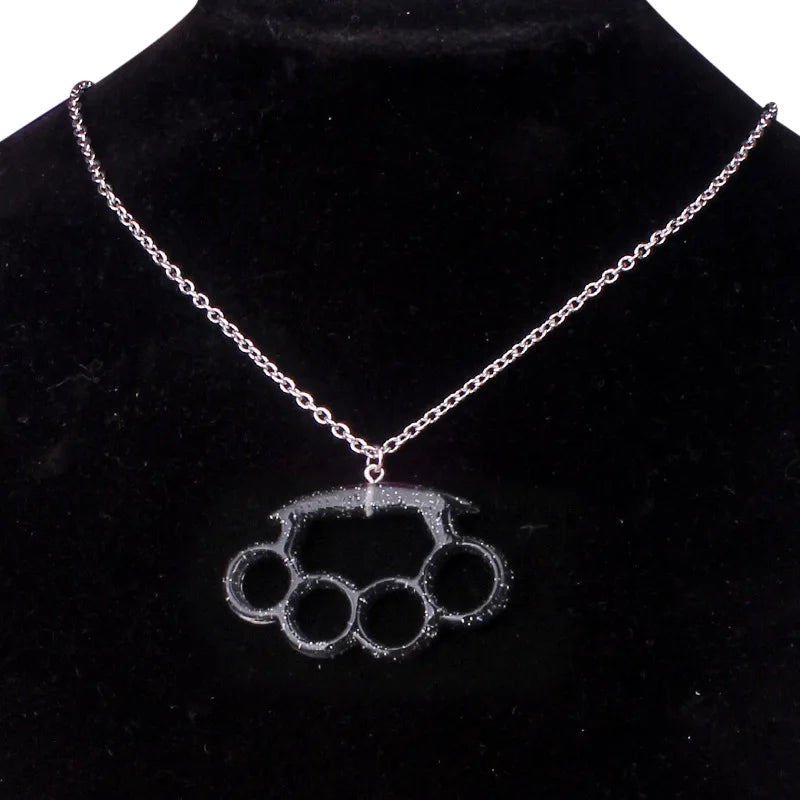 Resin imitation four-finger boxing glove joint pendant necklace with metal chain, fashionable jewelry for women.