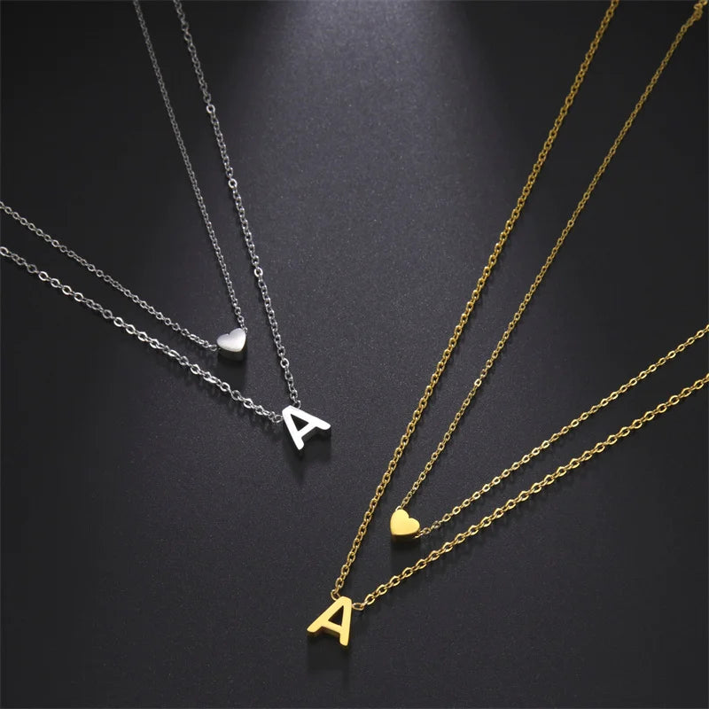 Gold and silver layered tiny heart initial necklace for women by HSF Marketplace