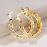 Huitan hollow out hoop earrings for women in modern metal style, close-up view