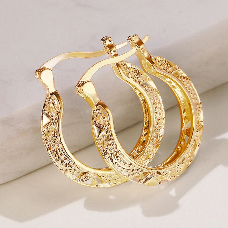 Huitan hollow out hoop earrings for women in modern metal style, close-up view