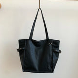 Black Rivet Design women's shoulder handbag with large capacity, elegant office style, featuring brand details and spacious tote design.
