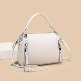 Genuine leather designer women's messenger bag with high capacity, crossbody style, and shoulder strap, in luxurious cowhide design.