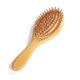 Wooden bamboo hair brush by HSF Marketplace for healthy scalp and reduced hair loss