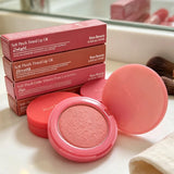 Close-up of HSF Marketplace matte lipstick and natural powder blusher, showcasing smooth application and portable makeup products.