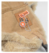 Black and grey Russian ushanka bomber hat with thick warm fur, earflaps, and winter ski cap design for women and men