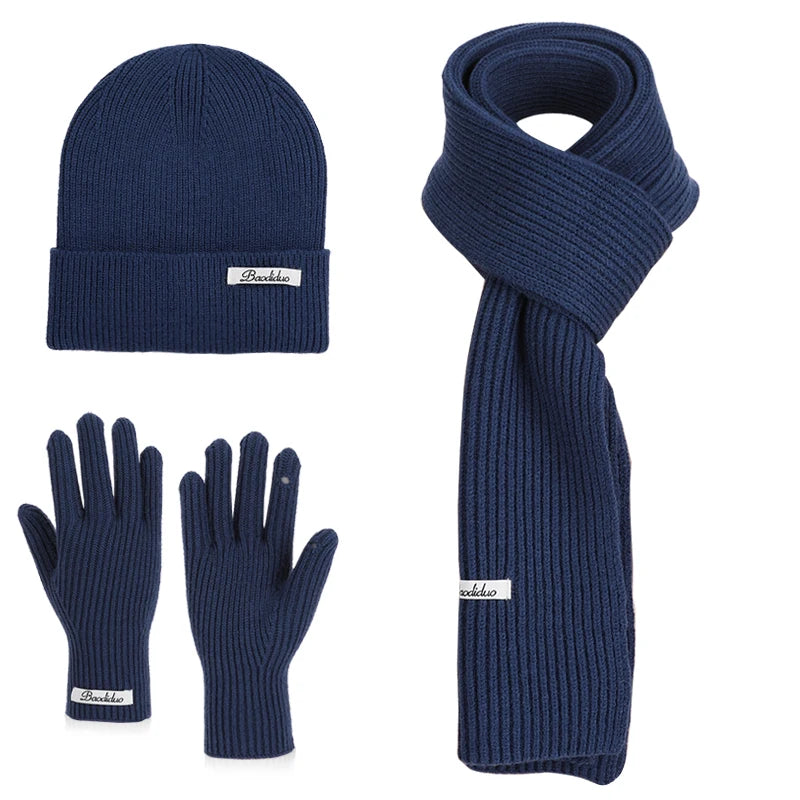 Warm knitted wool winter hat, gloves and scarf set in a coordinated design for cold-weather protection