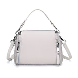 Elegant genuine leather messenger handbag for women with spacious interior, crossbody strap, and luxury cowhide design.