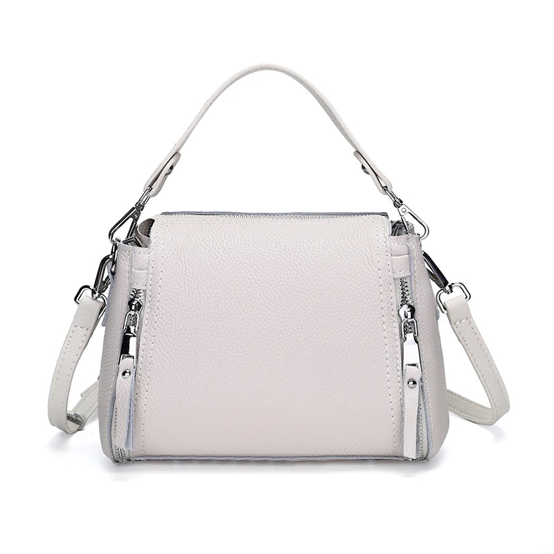Elegant genuine leather messenger handbag for women with spacious interior, crossbody strap, and luxury cowhide design.