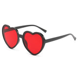 Pink love heart-shaped sunglasses for women with big vintage frames, UV400 protection, outdoor fashion eyewear from HSF Marketplace