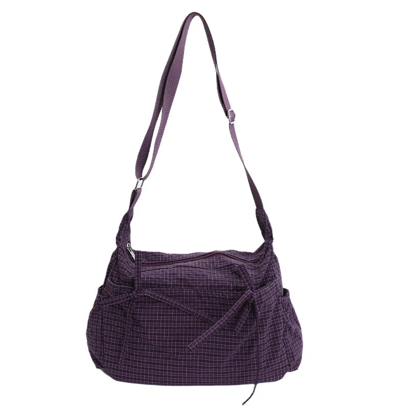 Women’s checkered nylon sling bag with drawstring, large capacity trendy crossbody handbag for shopping and casual outings.