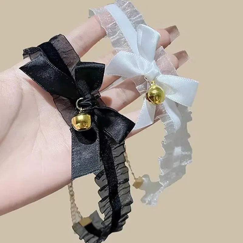 Women's gothic lace choker necklace with bow and small bell pendant, featuring a cute and fashionable jewelry design.