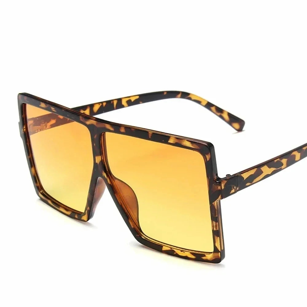 Square women's sunglasses with clear lenses and plastic frame, UV400 protection, stylish eyewear for fashion and driving.
