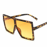 Square women's sunglasses with clear lenses and plastic frame, UV400 protection, stylish eyewear for fashion and driving.