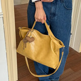 Luxury PU leather women’s handbag with spacious design, shoulder strap, and elegant style for commuting and office use.