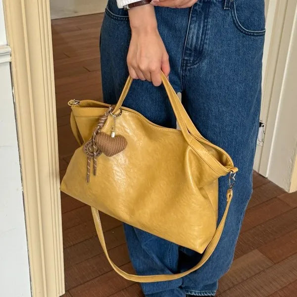 Luxury PU leather women’s handbag with spacious design, shoulder strap, and elegant style for commuting and office use.