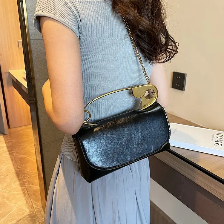 Red retro metal pin design women’s crossbody bag with PU leather, chain sling, clutch style, stylish handbag for ladies.