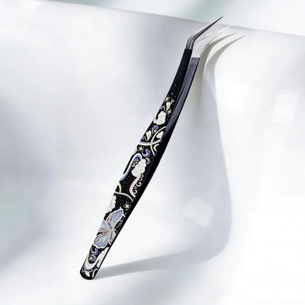 High precision stainless steel eyelash extension tweezers by Sticker Therapy, angled tips for lash application