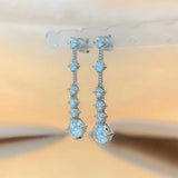 Moissanite dangle earrings with 3ct VVS1 stones and silver tassel design by HSF Marketplace