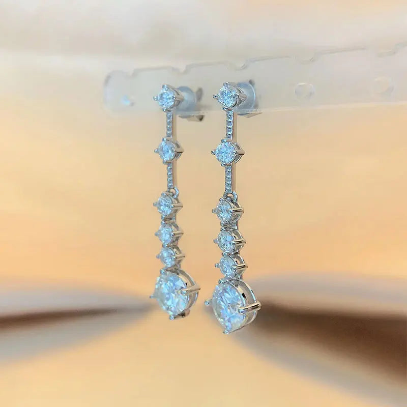 Moissanite dangle earrings with 3ct VVS1 stones and silver tassel design by HSF Marketplace