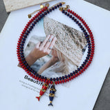 Hanging beaded necklace with red, blue, and natural stones, stainless steel fish pendant, multi-layer jewelry by HSF Marketplace