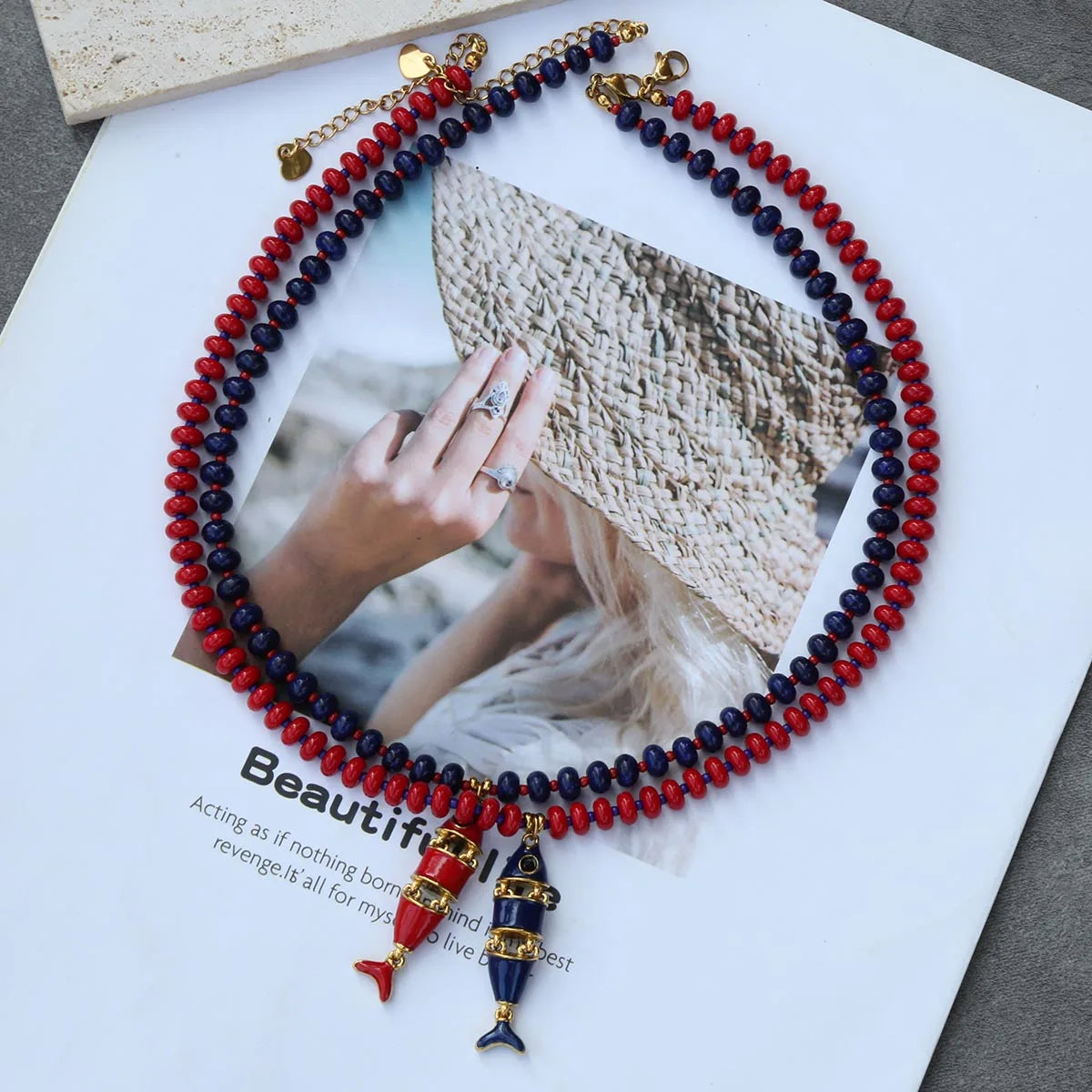 Hanging beaded necklace with red, blue, and natural stones, stainless steel fish pendant, multi-layer jewelry by HSF Marketplace