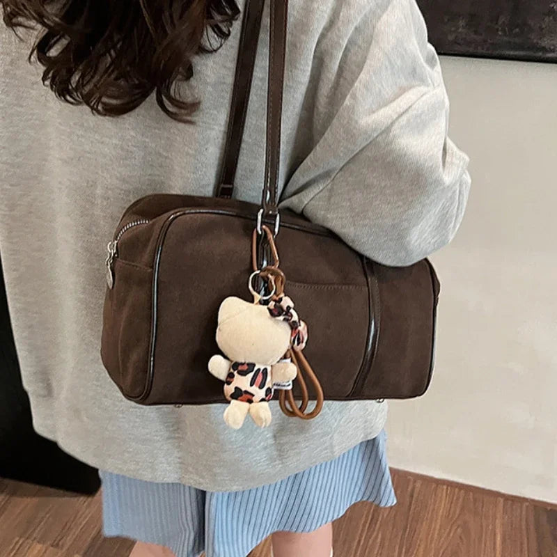 Large brown suede shoulder bag for women, retro style, casual design, suitable for autumn and winter, with a soft pillow-like appearance.