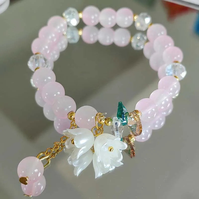 Colorful Lily Valley flower bracelet for women featuring crystal stones, elastic beaded jewelry ideal for weddings and birthdays.