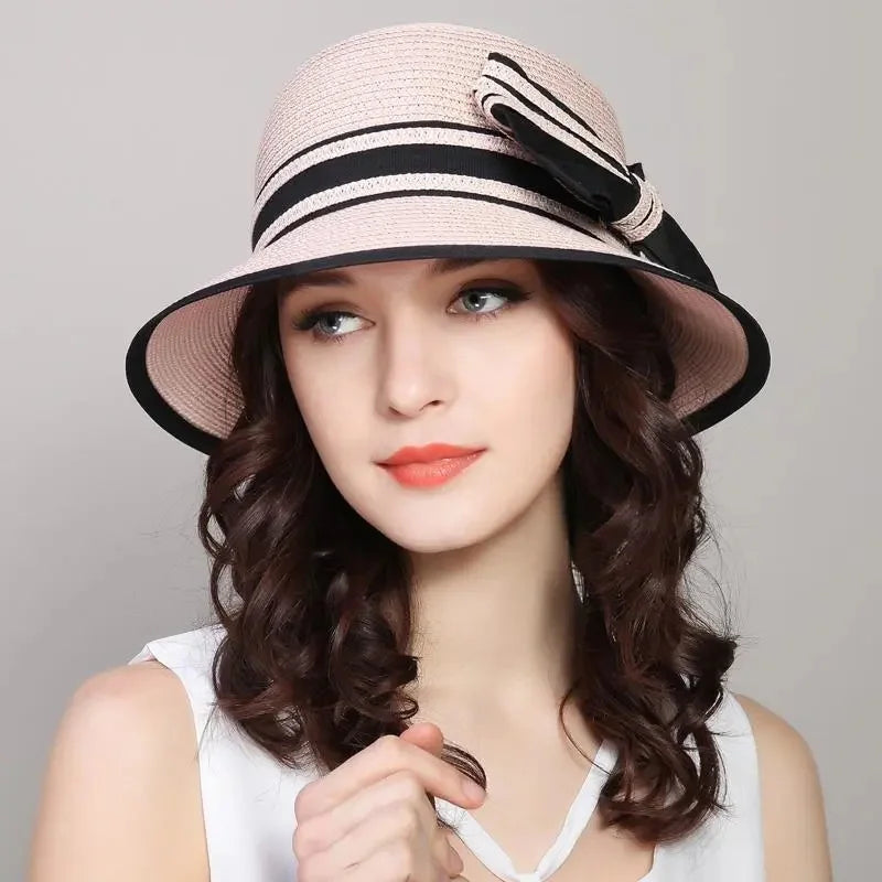 Muchique women's boater straw hat with wide brim and casual bow for summer beach travel