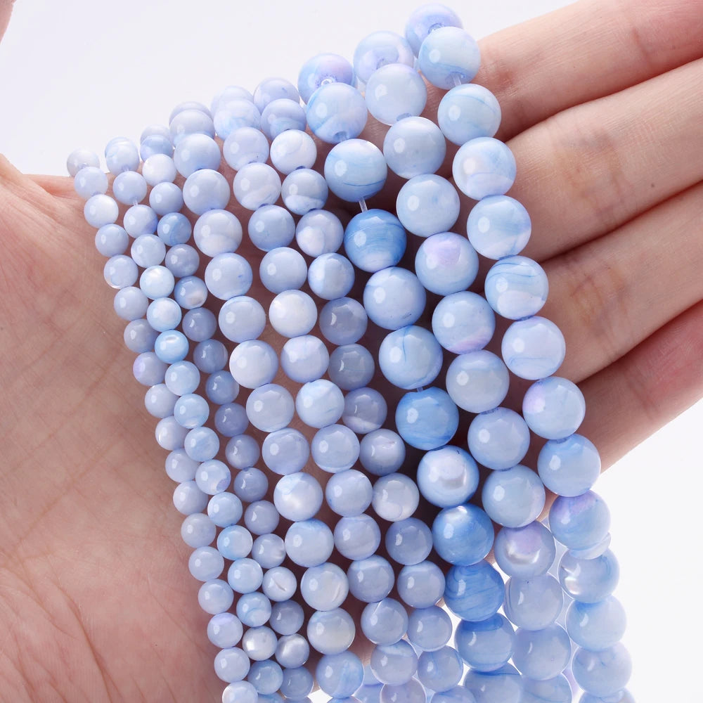 Natural freshwater shell pearls jewelry making beads, hair styling tools assortment.