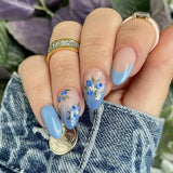 24-piece Y2K star press-on false nails with gradient blue French tips and gold moon designs, almond shape