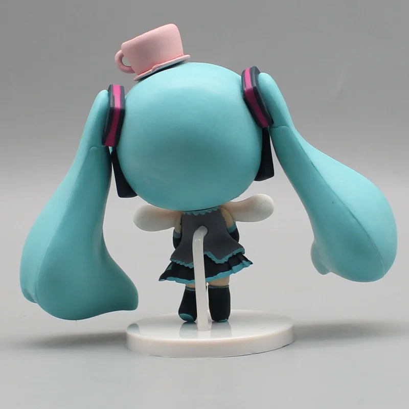 Hatsune Miku anime figurine holding a Cinnamoroll bean-eyed plush, kawaii tabletop collectible figure