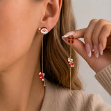 Moving Santa Claus tassel dangle earrings by HSF Marketplace for festive style