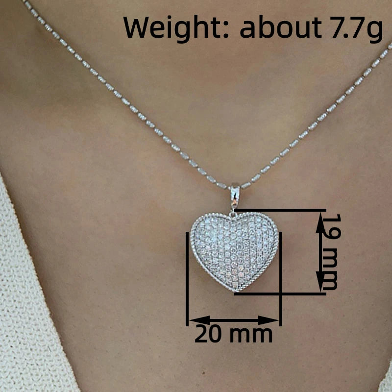 Huitan sparkling heart pendant necklace with cubic zirconia, elegant jewelry for women, perfect for wedding or party attire.