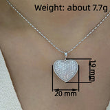 Huitan sparkling heart pendant necklace with cubic zirconia, elegant jewelry for women, perfect for wedding or party attire.