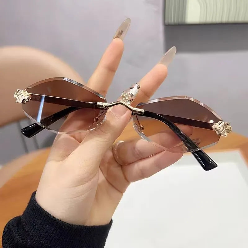 Frameless rhombus-shaped women's sunglasses by HSF Marketplace with UV400 protection, elegant, versatile, and high-end luxury eyewear.