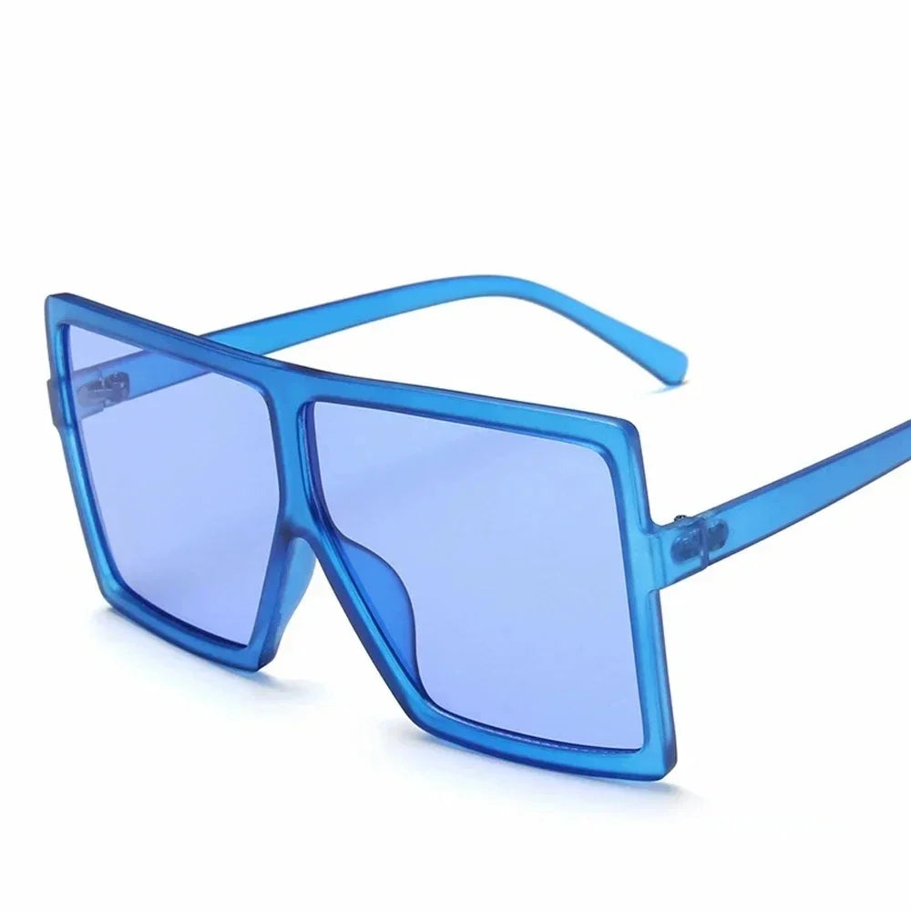 Square women's sunglasses with clear lenses, plastic frame, UV400 protection, stylish design, suitable for fashion and driving.