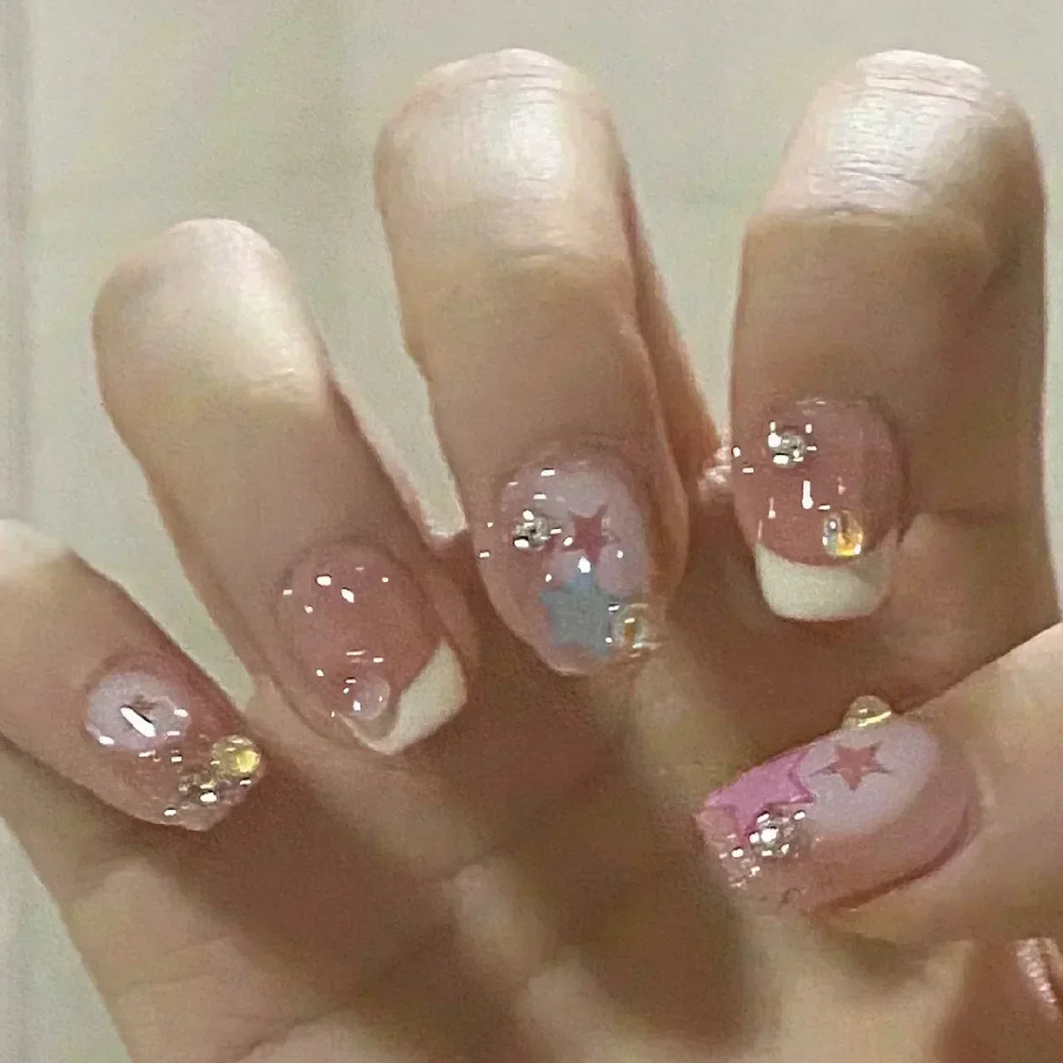 24-piece cute girly short square false nails with white French tips, glitter stars, rhinestones, cat eye, and bows