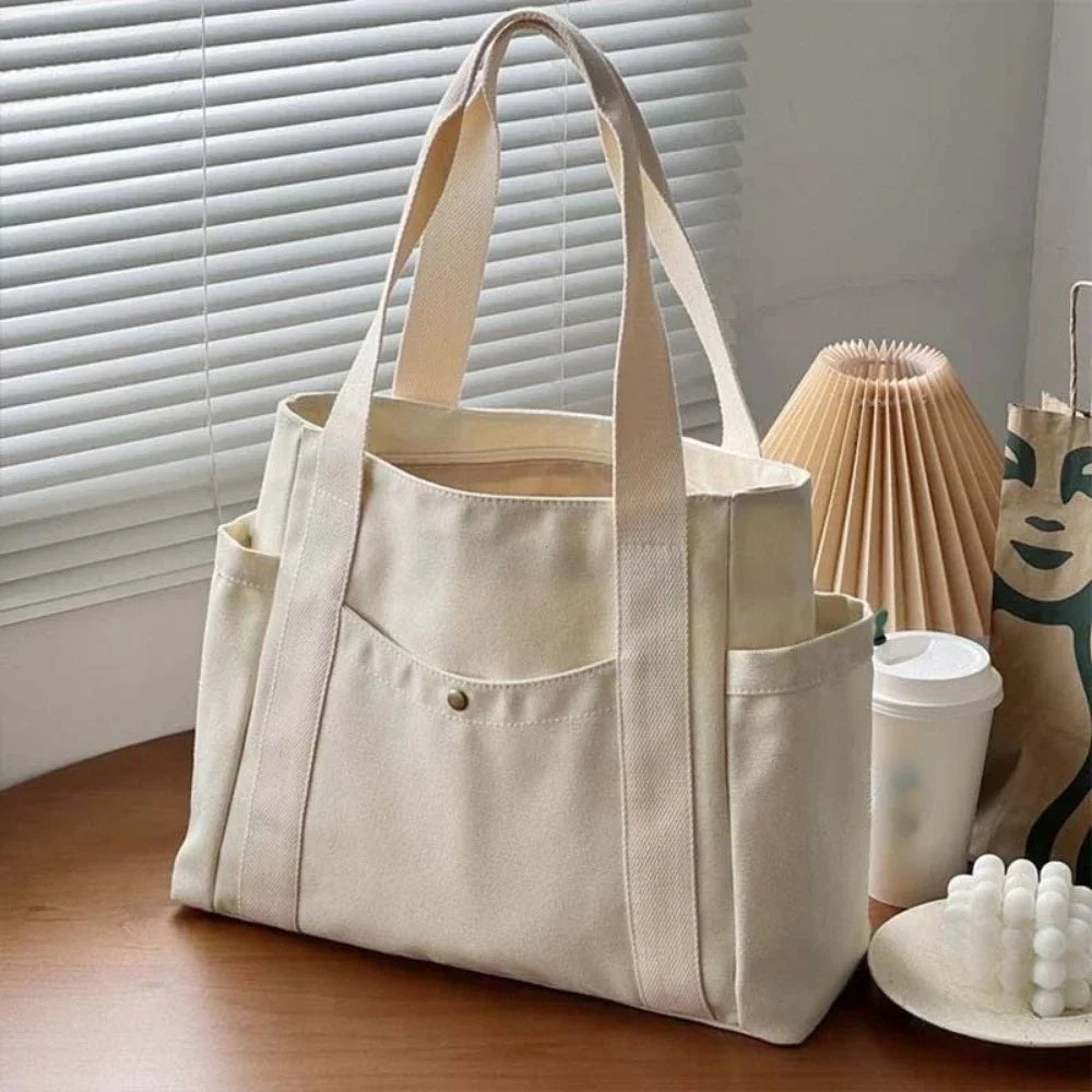 Large capacity canvas tote bag by HSF Marketplace with shoulder straps, ideal for work, college, or commuting.