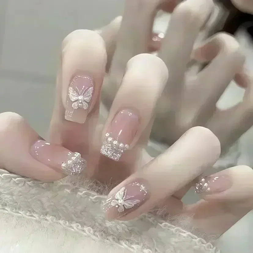 24-piece cute girly short square false nails with white French tips, glitter stars, rhinestones, bows and cat-eye accents