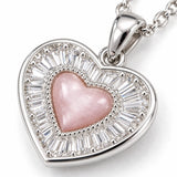 Pink heart crystal halo sunburst pendant necklace for women, elegant fashion jewelry with sparkling design.