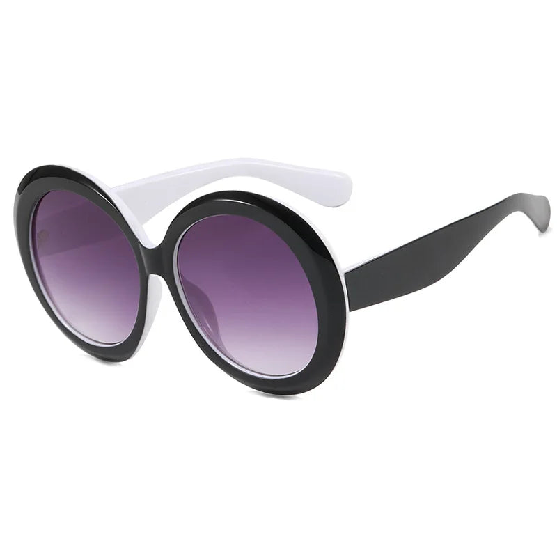 Large round sunglasses by HSF Marketplace featuring oversized frames, unisex design, luxury brand style, perfect for riding or sunny days.
