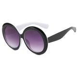 Large round sunglasses by HSF Marketplace featuring oversized frames, unisex design, luxury brand style, perfect for riding or sunny days.