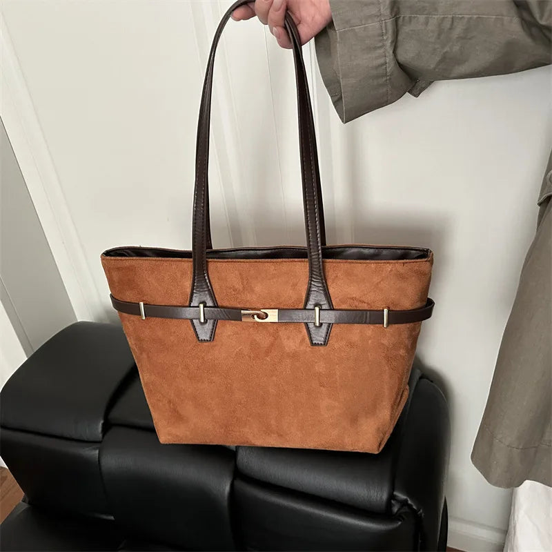 Leopard print shoulder tote bag with brown faux leather trim, gold lock detail, spacious handbags for women’s daily use.