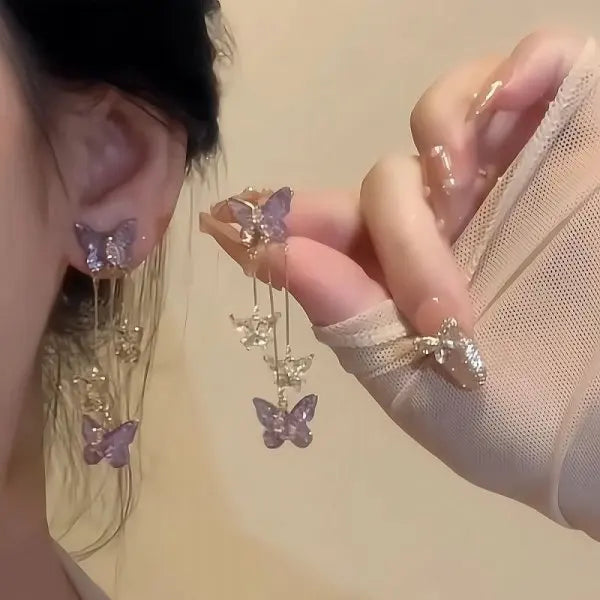 Purple butterfly drop earrings with sparkling rhinestone details by HSF Marketplace