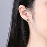 Tezzc moissanite stud earrings in 925 sterling silver with colorful green, blue, pink, red, and black stones