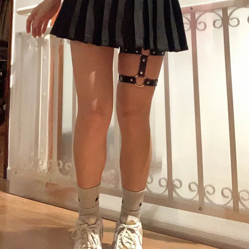 Women’s elastic PU leather thigh garter leg ring with heart rivets, spikes, and punk goth harness styling