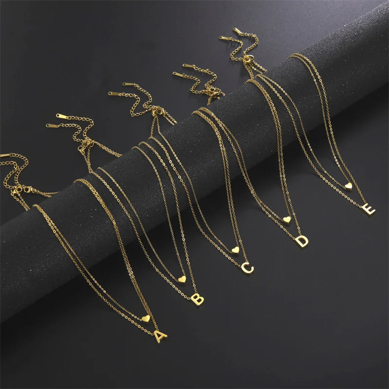 Tiny heart initial necklace for women with gold and silver layered charms, HSF Marketplace jewelry