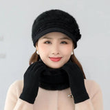 Warm knitted women’s winter hat, scarf, and gloves set in soft textured fabric